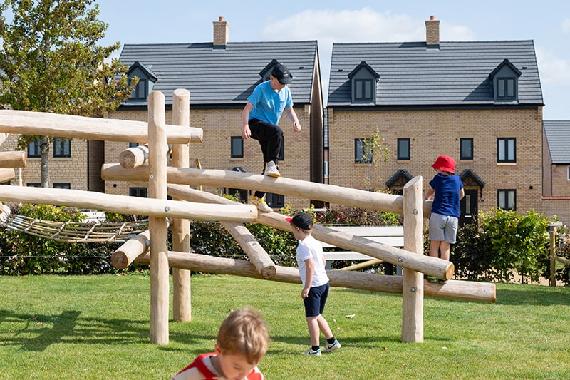 Children climbing at Priors Hall Park playpark